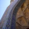 Intricate and colorful cut pieces of tiles used to create a grand entrance to the prayer area of the Jomeh Mosque.